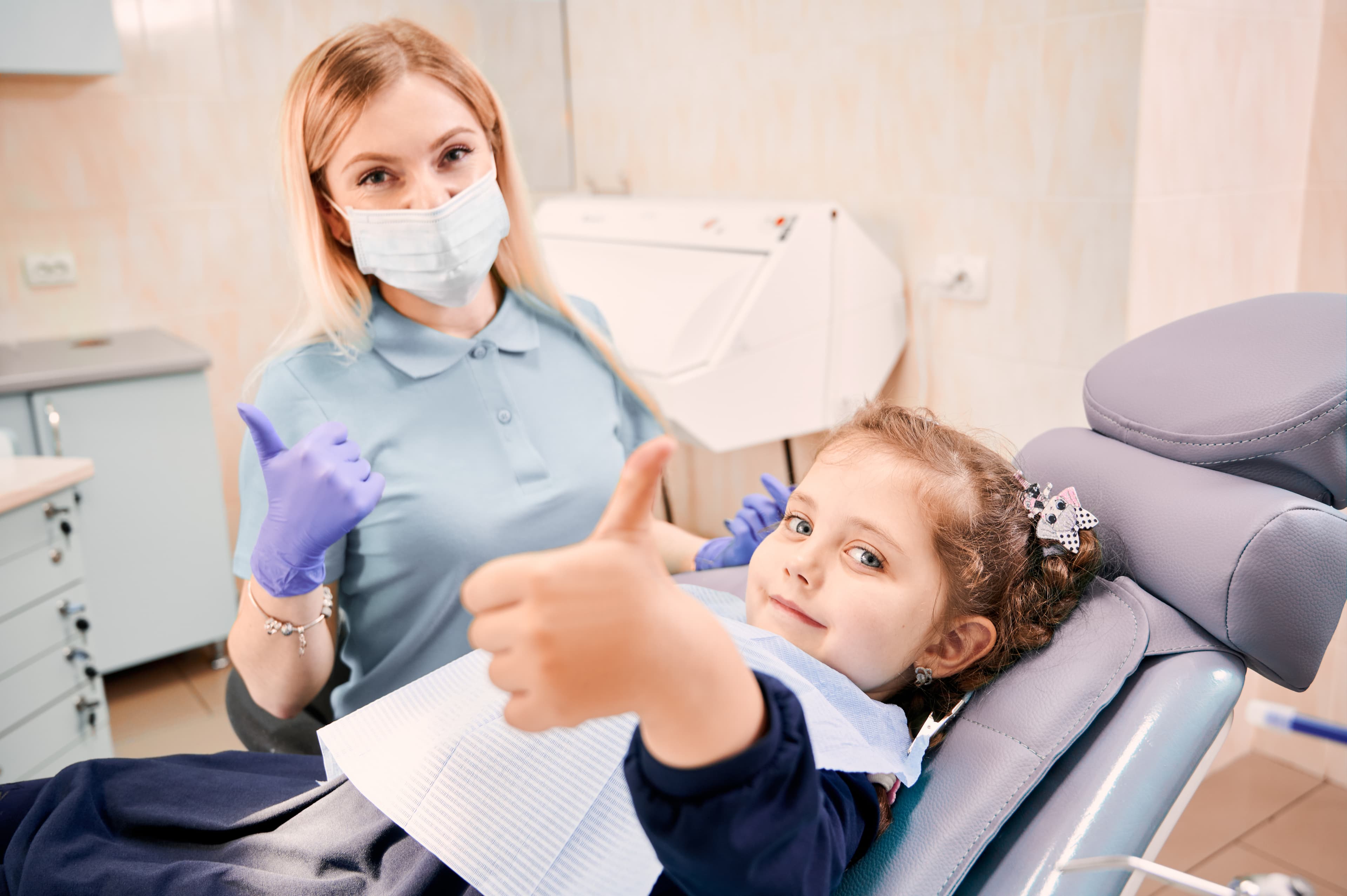 Dental professional with child patient