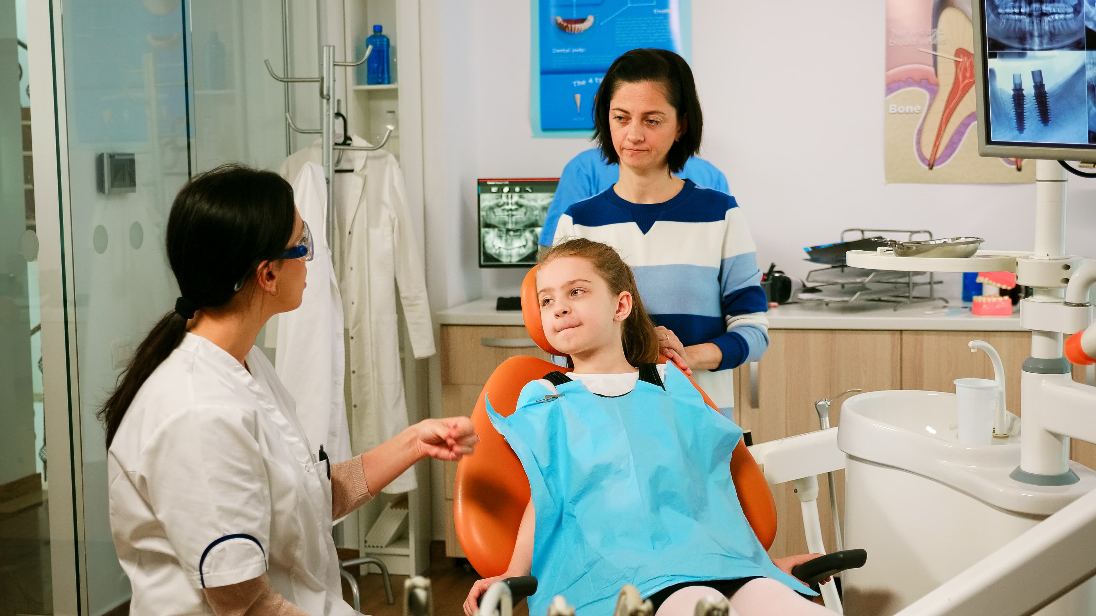 Child with dentist in friendly dental office
