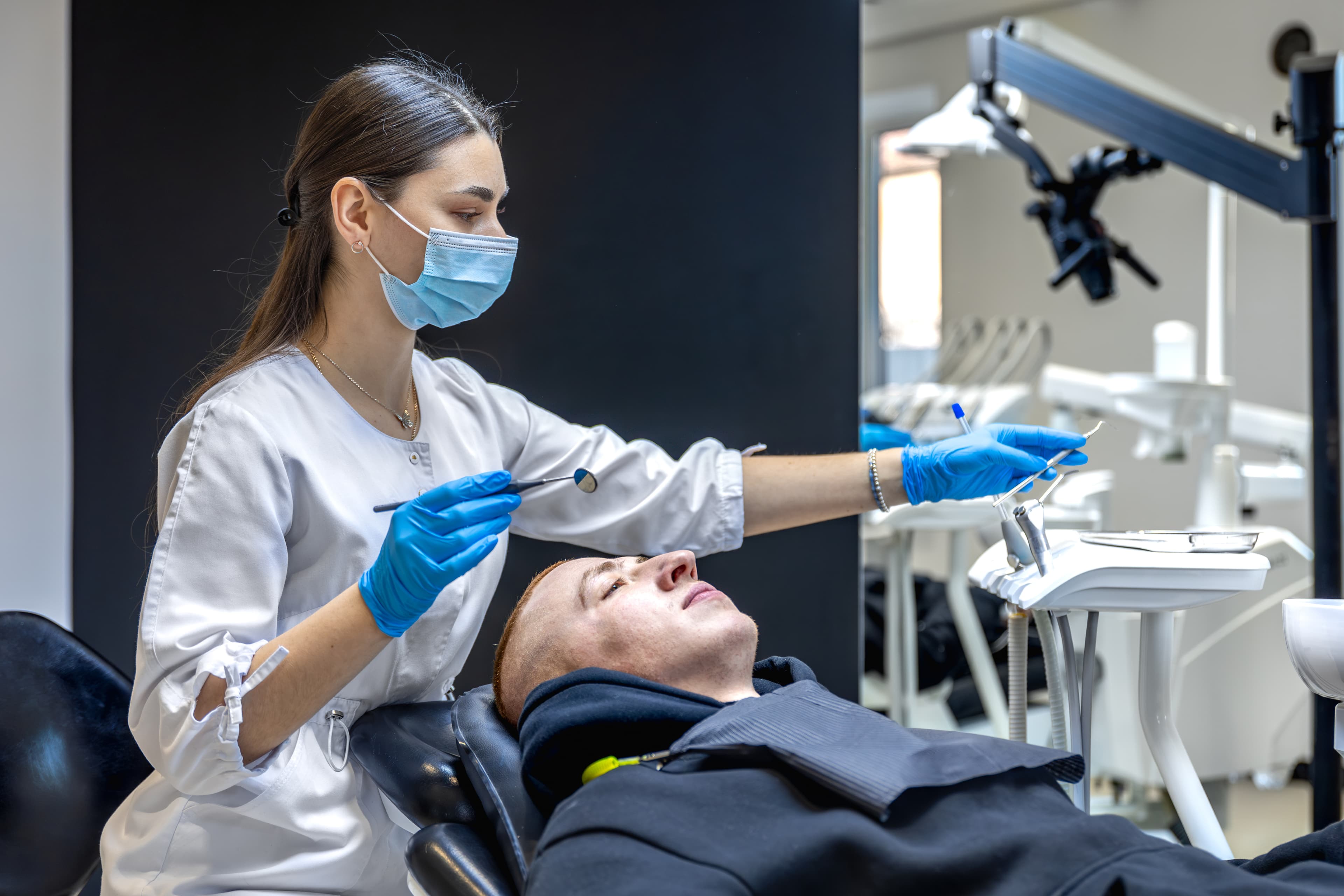 Dental professional treating patient