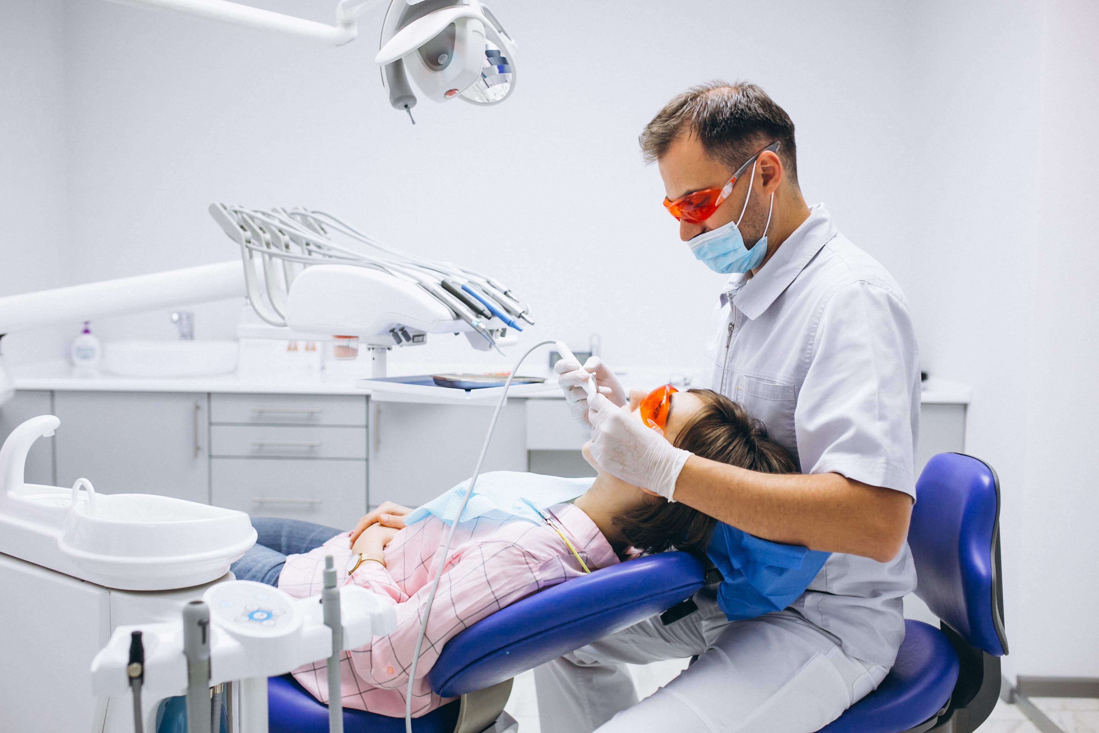 Dentist treating patient